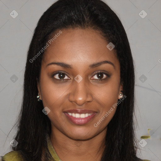 Joyful black young-adult female with long  brown hair and brown eyes