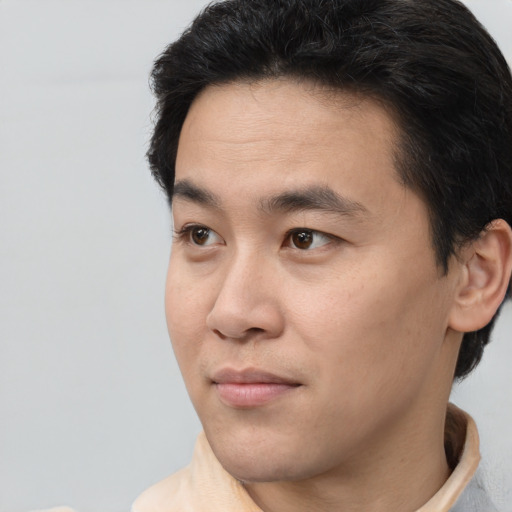 Neutral white young-adult male with short  black hair and brown eyes