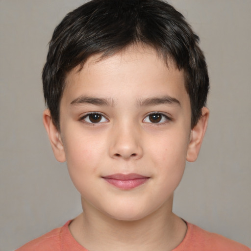 Joyful white child male with short  brown hair and brown eyes