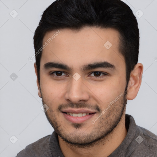 Joyful latino young-adult male with short  black hair and brown eyes