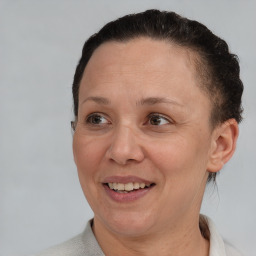 Joyful white adult female with short  brown hair and brown eyes