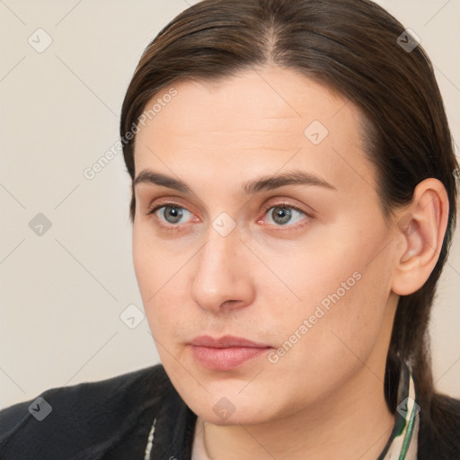 Neutral white young-adult female with long  brown hair and brown eyes