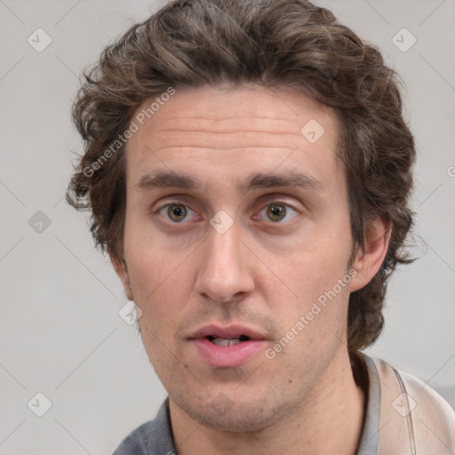 Joyful white adult male with short  brown hair and grey eyes