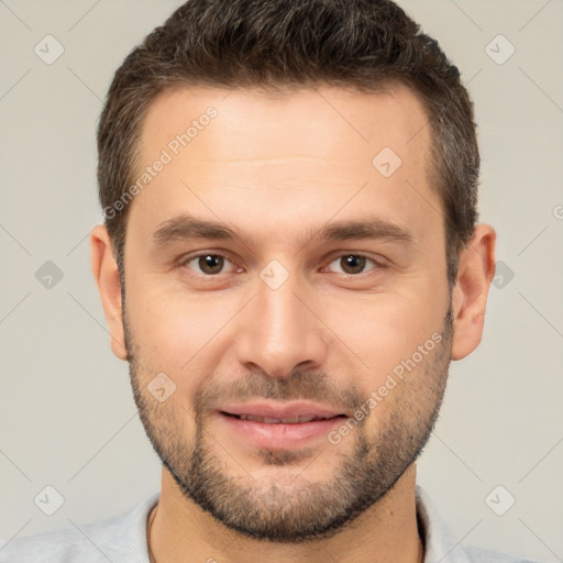 Joyful white young-adult male with short  brown hair and brown eyes