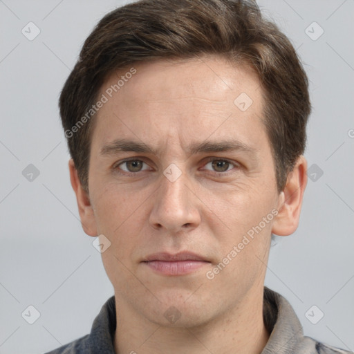 Joyful white adult male with short  brown hair and grey eyes