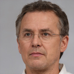 Neutral white middle-aged male with short  brown hair and brown eyes