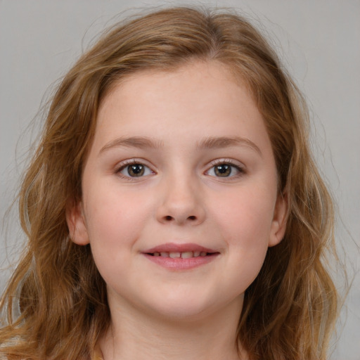 Joyful white child female with medium  brown hair and blue eyes