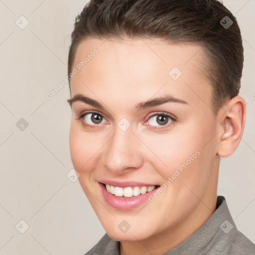 Joyful white young-adult female with short  brown hair and brown eyes