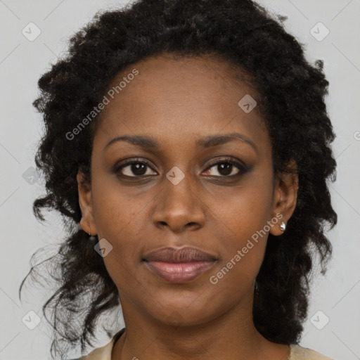 Joyful black young-adult female with long  brown hair and brown eyes