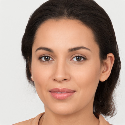 Joyful white young-adult female with medium  brown hair and brown eyes