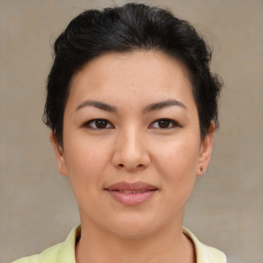 Joyful asian young-adult female with short  brown hair and brown eyes