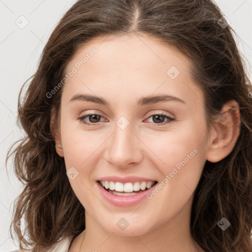 Joyful white young-adult female with long  brown hair and green eyes