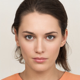 Neutral white young-adult female with medium  brown hair and brown eyes