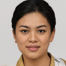 Joyful asian young-adult female with short  black hair and brown eyes