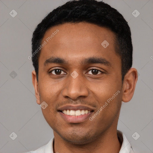 Joyful latino young-adult male with short  black hair and brown eyes