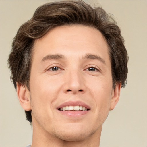 Joyful white adult male with short  brown hair and brown eyes