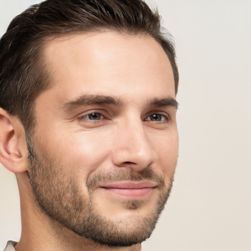 Joyful white young-adult male with short  brown hair and brown eyes