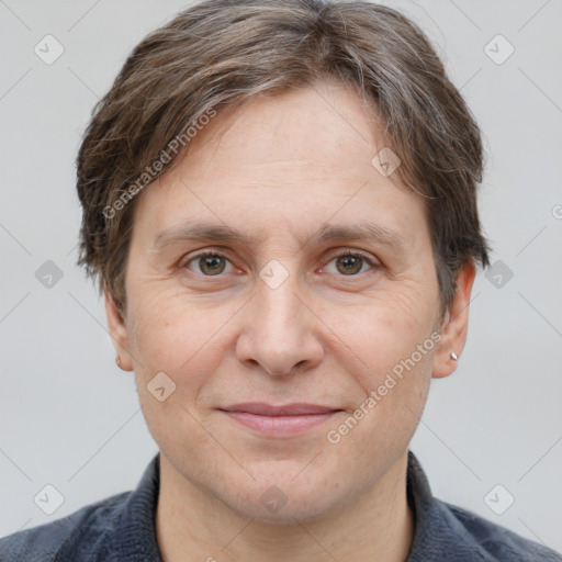 Joyful white adult male with short  brown hair and grey eyes