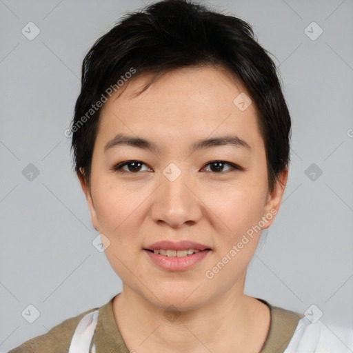 Joyful asian young-adult female with short  black hair and brown eyes