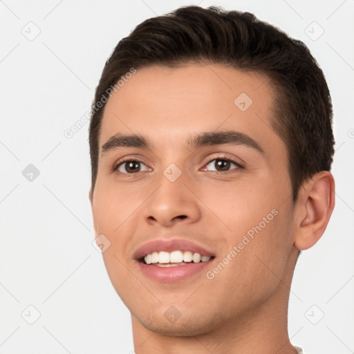 Joyful white young-adult male with short  brown hair and brown eyes