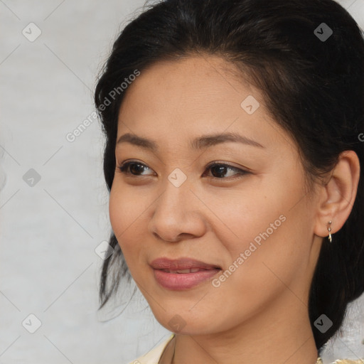 Joyful asian young-adult female with medium  brown hair and brown eyes