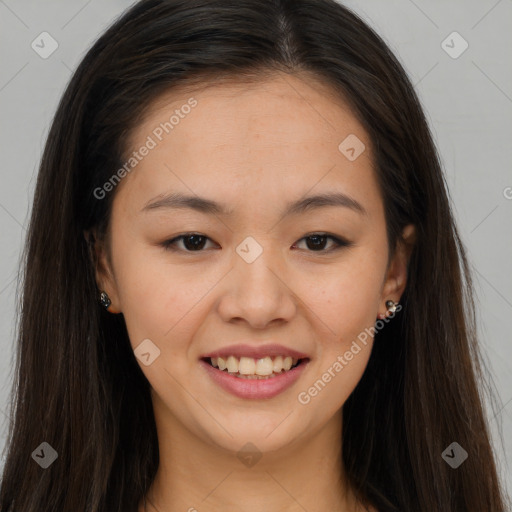 Joyful asian young-adult female with long  brown hair and brown eyes