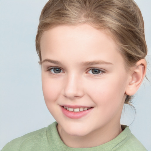 Joyful white child female with short  brown hair and brown eyes