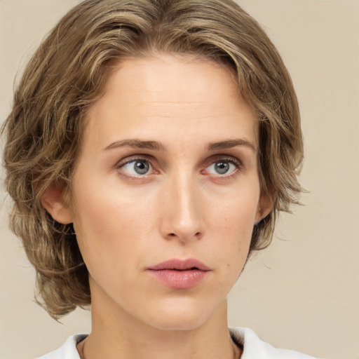 Neutral white young-adult female with medium  brown hair and green eyes