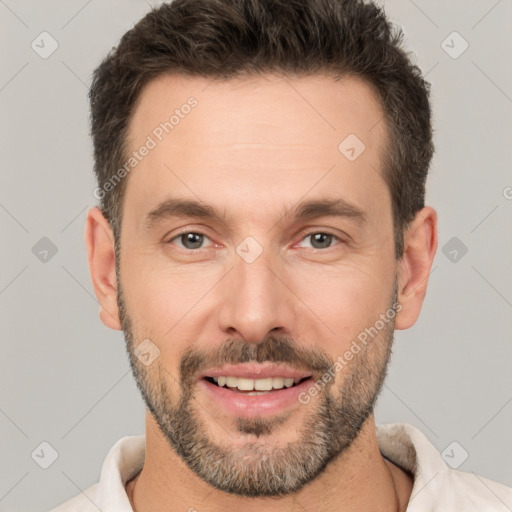 Joyful white adult male with short  brown hair and brown eyes