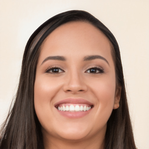 Joyful white young-adult female with long  black hair and brown eyes