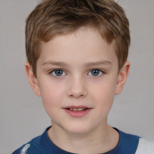 Joyful white child male with short  brown hair and grey eyes