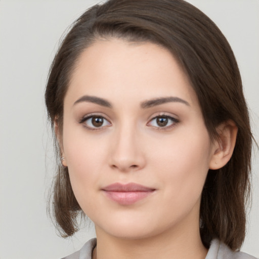 Neutral white young-adult female with medium  brown hair and brown eyes