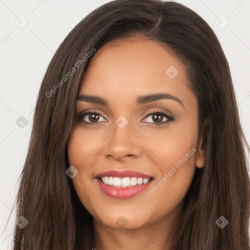 Joyful latino young-adult female with long  brown hair and brown eyes