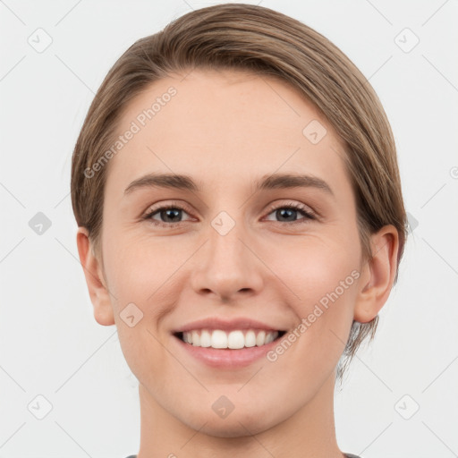 Joyful white young-adult female with short  brown hair and grey eyes