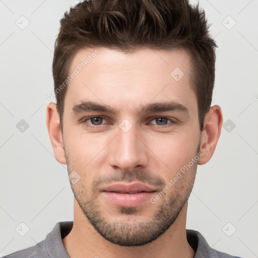 Neutral white young-adult male with short  brown hair and brown eyes