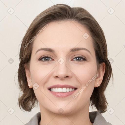 Joyful white young-adult female with medium  brown hair and grey eyes