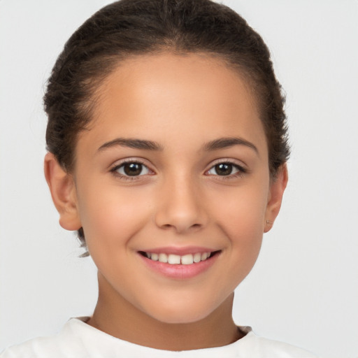 Joyful white child female with short  brown hair and brown eyes