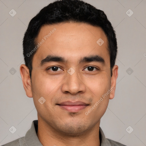 Joyful latino young-adult male with short  black hair and brown eyes