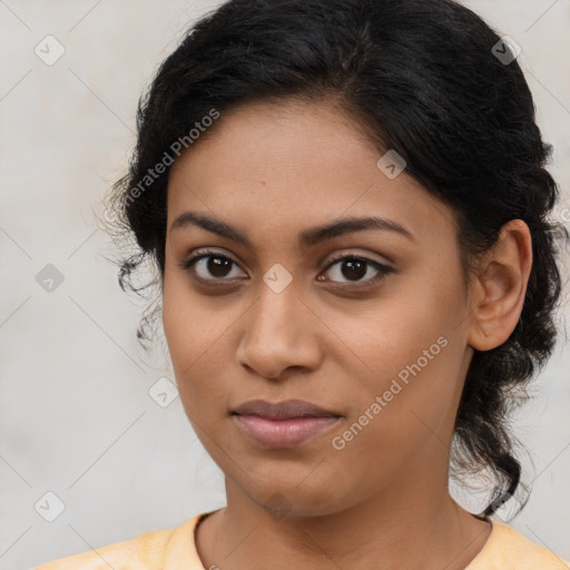 Joyful latino young-adult female with medium  brown hair and brown eyes