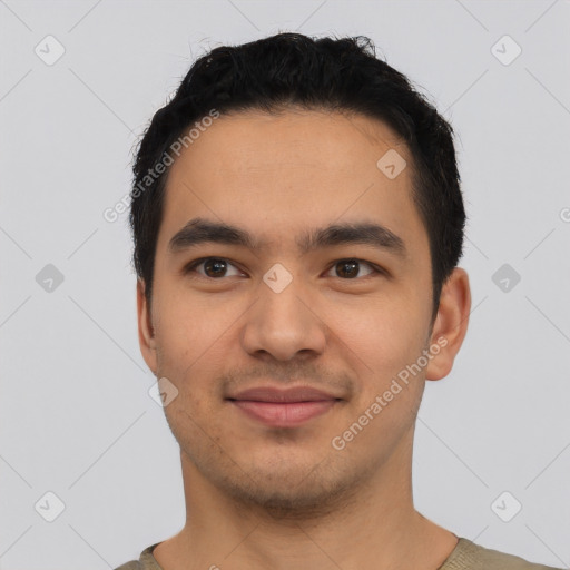 Joyful latino young-adult male with short  black hair and brown eyes