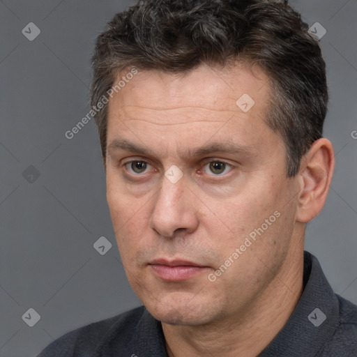 Neutral white adult male with short  brown hair and brown eyes