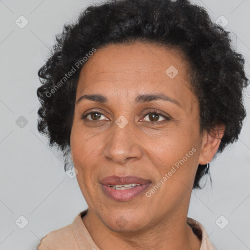 Joyful black adult female with short  brown hair and brown eyes