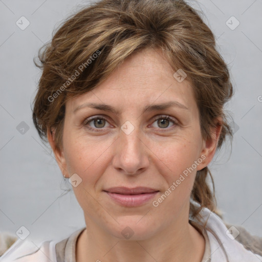 Joyful white adult female with medium  brown hair and grey eyes