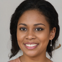 Joyful black young-adult female with medium  brown hair and brown eyes