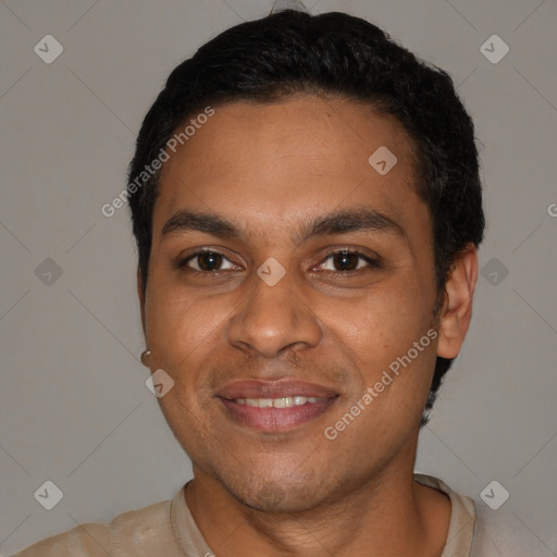 Joyful black young-adult male with short  black hair and brown eyes