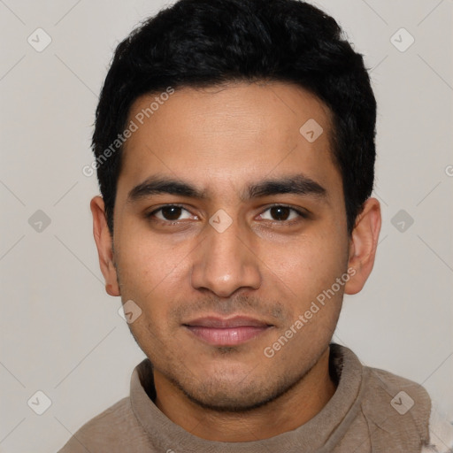 Joyful latino young-adult male with short  black hair and brown eyes