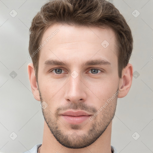 Neutral white young-adult male with short  brown hair and grey eyes