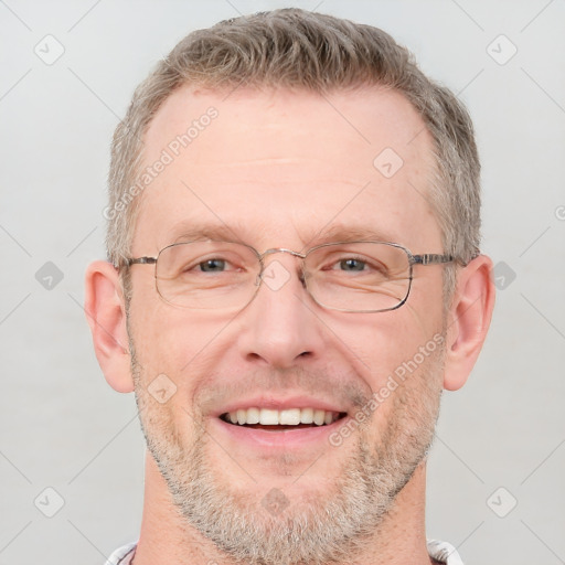 Joyful white adult male with short  brown hair and grey eyes