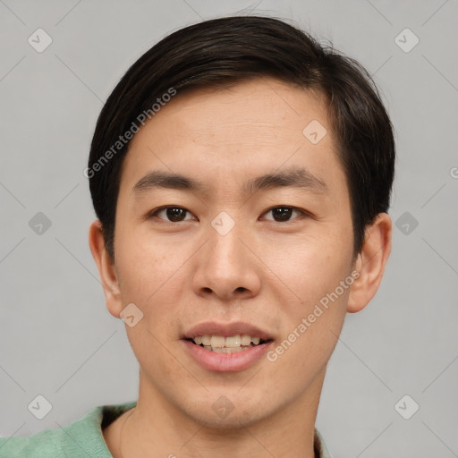 Joyful asian young-adult male with short  brown hair and brown eyes