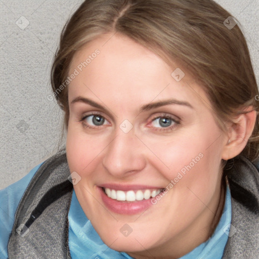 Joyful white young-adult female with medium  brown hair and blue eyes